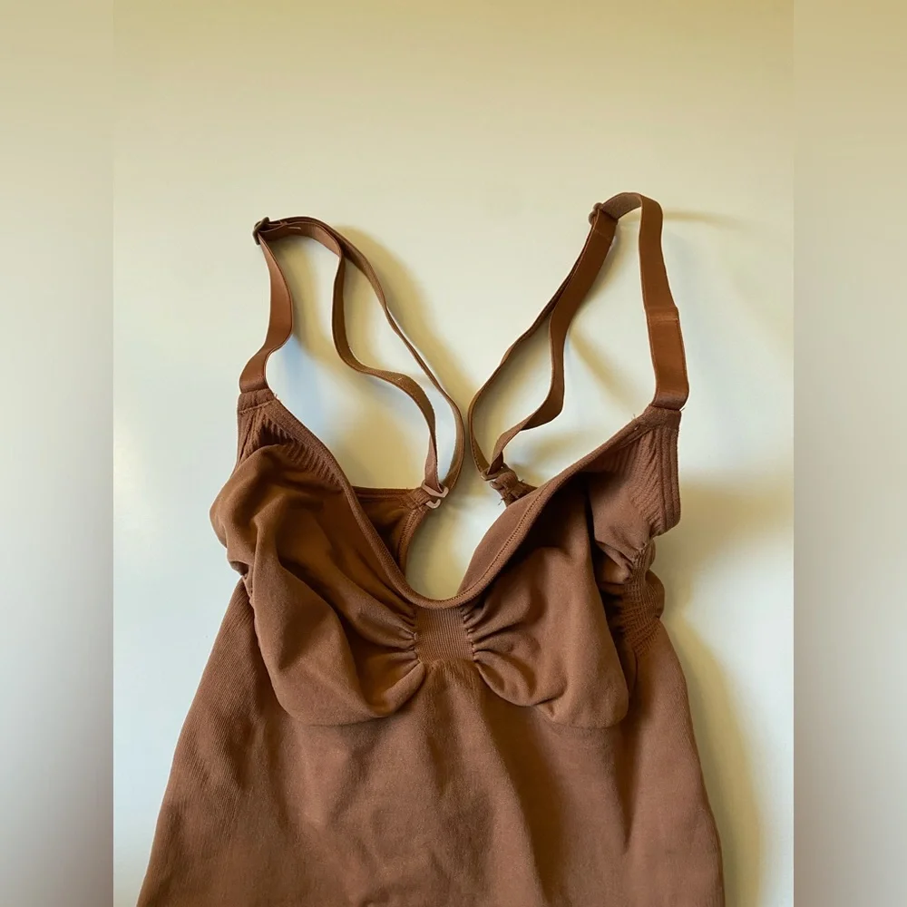 Skims Seamless Sculpting Thong Bodysuit in Bronze